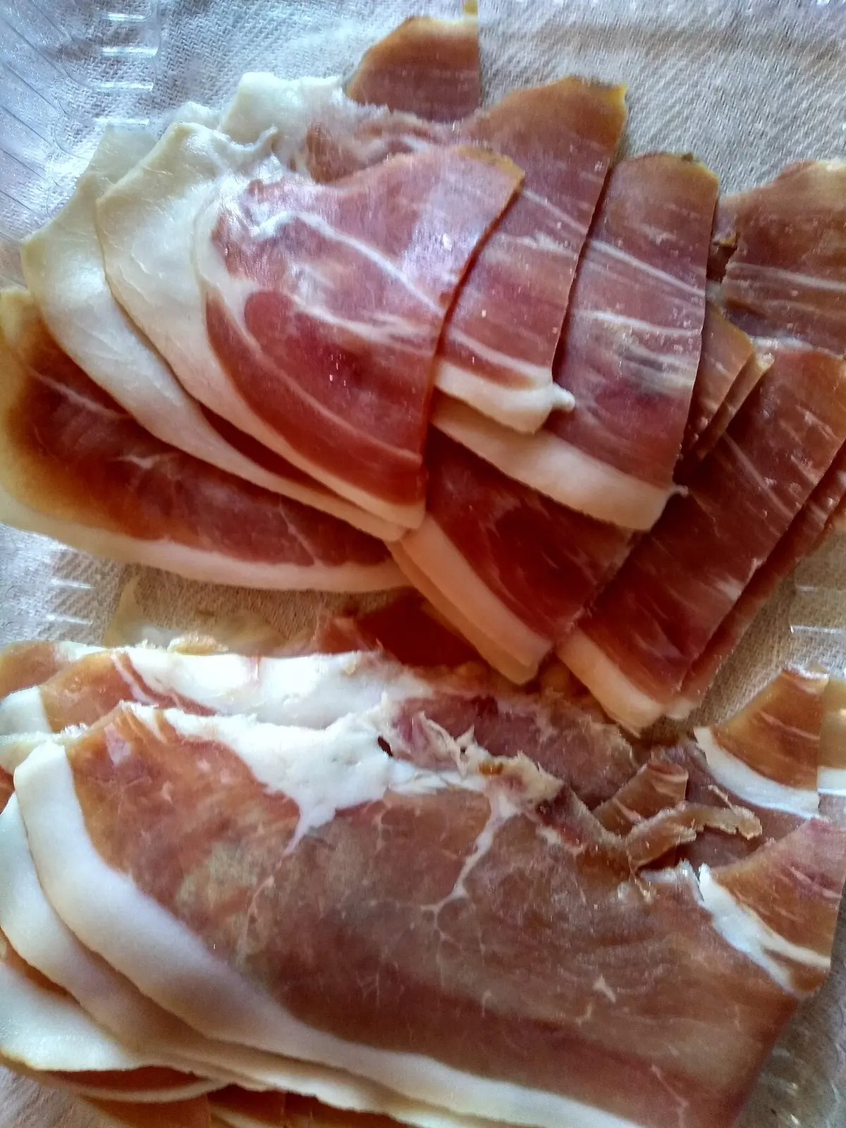 Thin slices of Njeguški pršut, the smoked dry-cured ham from the Montenegrin mountains
